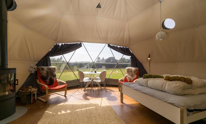 Bright and airy inside the Nature Domes include a wood burner for a lovely warm evening fire, and comfortable accommodation for up to four people.